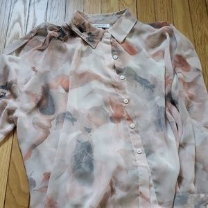 Jennifer Lopez flowy blouse with shoulder cutouts